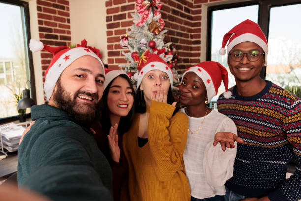 istock Colleagues posing for christmas selfie 1635637008
