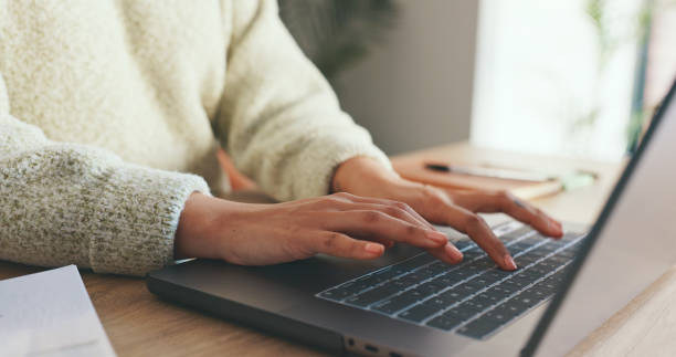 istock Laptop, computer and business woman hand typing, writing on notebook for planning, schedule and meeting review. Zoom, hands and strategy analytics for collaboration, research and KPI growth 1635669437