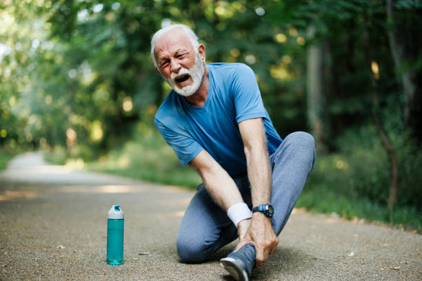 istock Senior man runner with ankle pain in the park 1635701293
