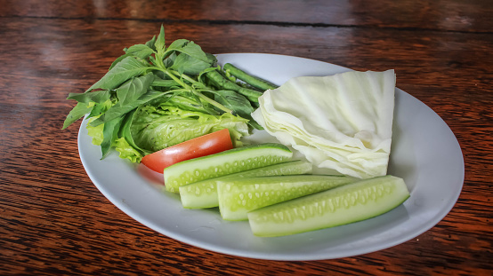 Lalap or Lalapan is fresh raw vegetables served with sambal or chili sauce, usually eaten with fried chicken, grilled chicken, fried fish, grilled fish.