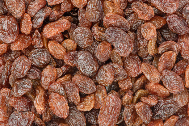 istock Full frame of sweet raisins as background, raisins texture. 1635739780