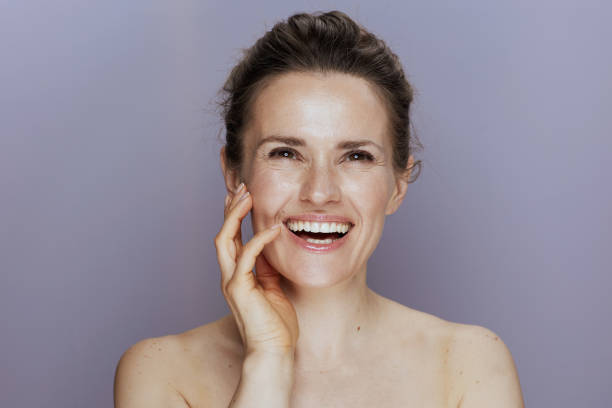 istock happy modern 40 years old woman on blue 1635745145
