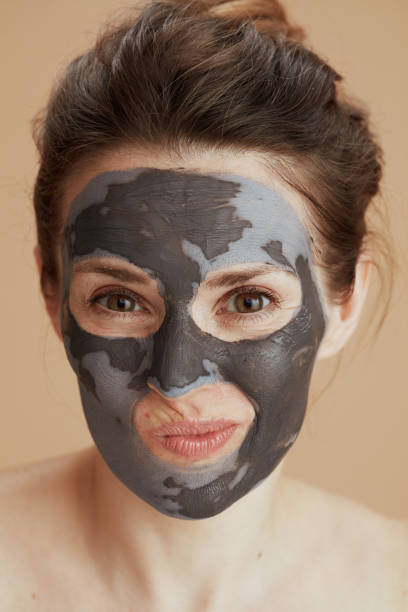istock doubting woman with facial mask 1635745662