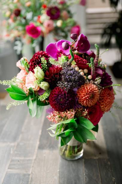 istock Colorful wedding florals on a wooden background. 1635746228