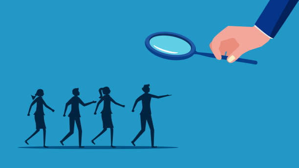 istock Find human resources. Businessman using a magnifying glass to select job applicants 1635746815