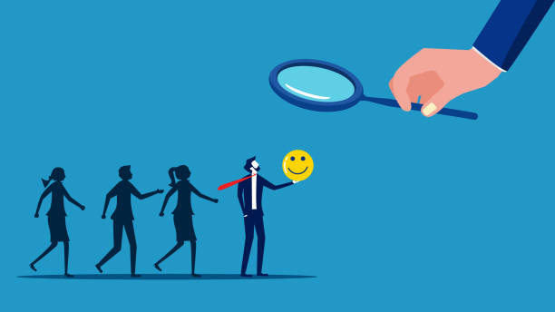 istock Good recruitment. Businessman using a magnifying glass to select kind hearted job candidates 1635751726