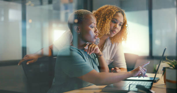 istock Office glass window, laptop and team communication on social network feedback, customer experience or ecommerce. Brand monitoring data, collaboration teamwork and black women review online survey 1635753931