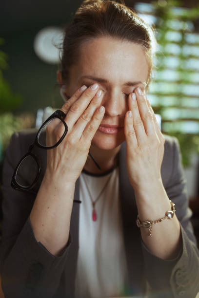 istock stressed modern business woman at work with eyeglasses 1635764134