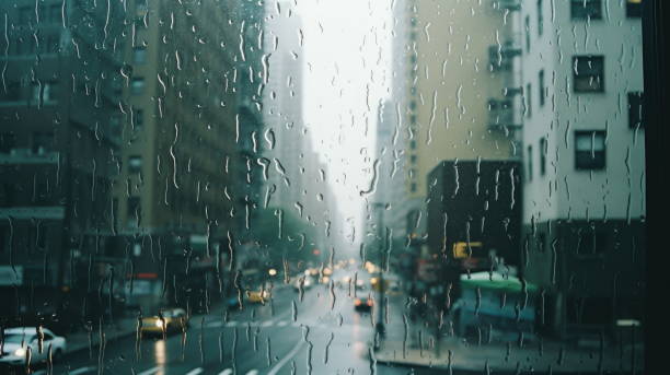 istock Rainy City Reflections: View through a Wet Window on 35mm 1635767776