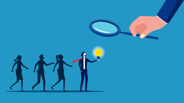 istock Recruiting knowledgeable personnel. Businessman using a magnifying glass to select smart job candidates 1635769213