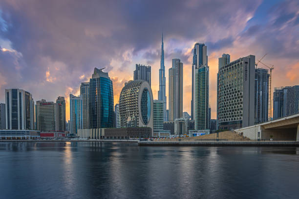 istock Dubai skyline with the evening sun and cloudy sky 1635776975