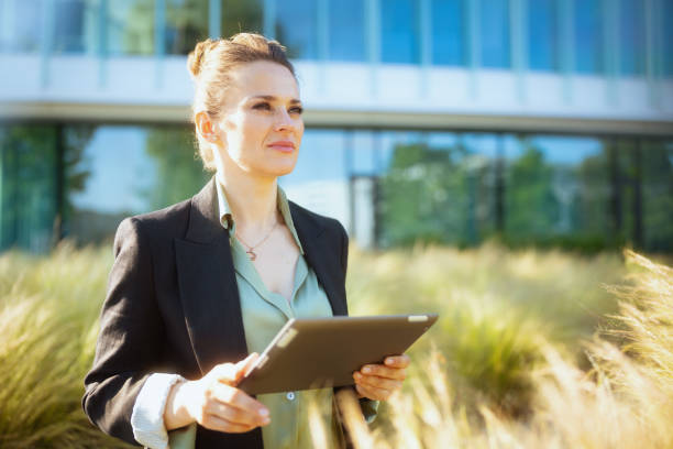 istock pensive modern female worker in business district 1635778056
