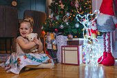 Cheerful little girl with Christmas presents