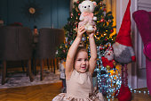 Cheerful little girl with Christmas presents