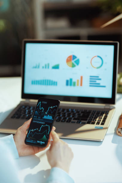 istock Seen from behind modern woman buying cryptocurrency 1635794869
