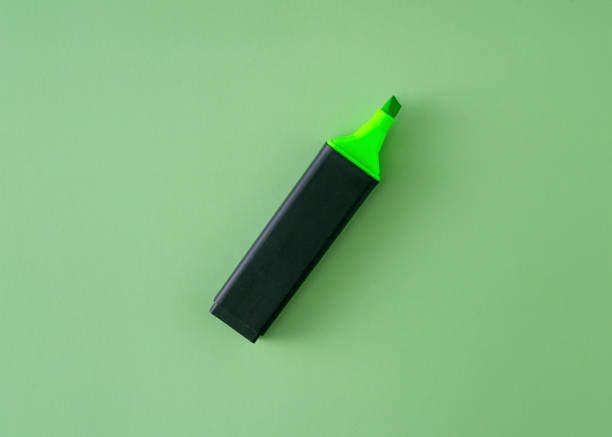 yellow highlighter pen isolated in a studio on a black background