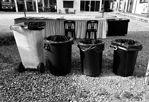 Several small and large trash cans are prepared for sorting each type of waste.
