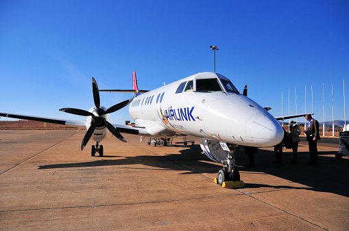 Mazenod, Maseru, Lesotho: passengers board an Airlink British Aerospace Jetstream 41, turboprop-powered feederliner / regional airliner (registration ZS-NRJ, MSN 41062) - apron of Maseru airport, Moshoeshoe I International Airport - Airlink (formerly SA Airlink or South African Airlink ) is a South African regional airline headquartered in Johannesburg and based at OR Tambo Airport. Airlink connects numerous cities within South Africa. Airlink also flies to other African destinations in Zimbabwe, Mozambique and Madagascar.
