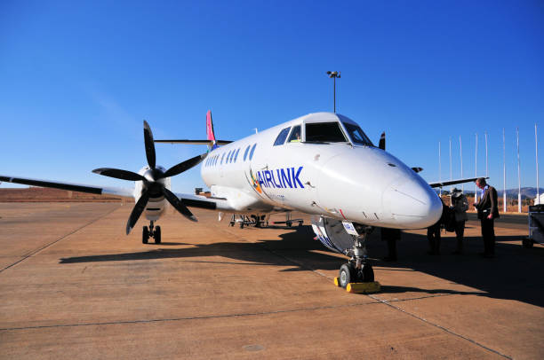 Airlink British Aerospace Jetstream 41, Maseru, Lesotho Mazenod, Maseru, Lesotho: passengers board an Airlink British Aerospace Jetstream 41, turboprop-powered feederliner / regional airliner (registration ZS-NRJ, MSN 41062) - apron of Maseru airport, Moshoeshoe I International Airport - Airlink (formerly SA Airlink or South African Airlink ) is a South African regional airline headquartered in Johannesburg and based at OR Tambo Airport. Airlink connects numerous cities within South Africa. Airlink also flies to other African destinations in Zimbabwe, Mozambique and Madagascar. british aerospace stock pictures, royalty-free photos & images