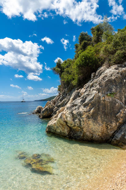 Beautiful beach in summer of Paralia Mikros Gialos in the south of the island of Lefkada. Greece. Beautiful beach in summer of Paralia Mikros Gialos in the south of the island of Lefkada. Greece. paralia stock pictures, royalty-free photos & images