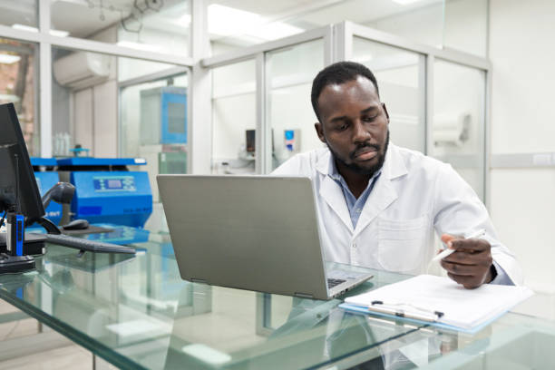 istock Male medical worker preparing notes at desk in laboratory 1635838020