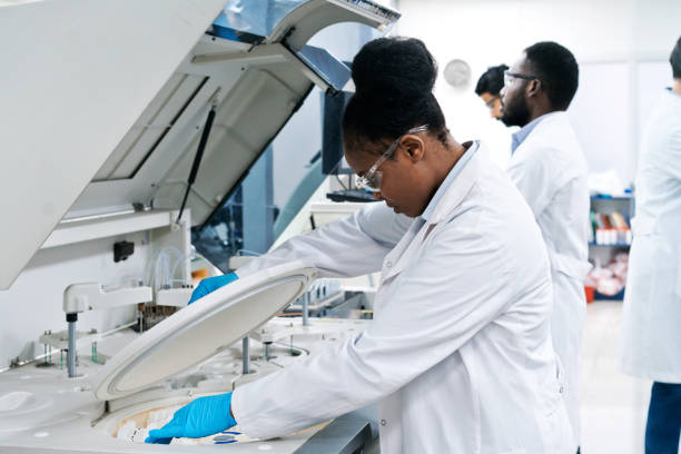 istock Side view of female medical worker working in laboratory 1635846679