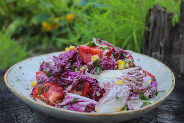 istock fresh salad of tomatoes and purple chinese cabbage 1635898621