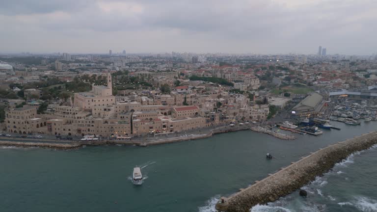 Aerial footage of the waterfront of Tel Aviv - Yafo  at afternoon and dusk in summer