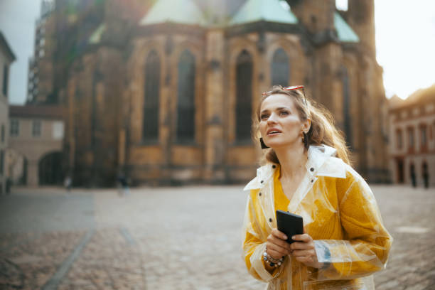 istock woman in Prague having walking tour and using phone 1635941199