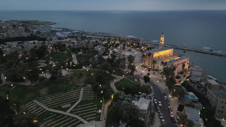 Aerial footage of the waterfront of Tel Aviv - Yafo  at afternoon and dusk in summer