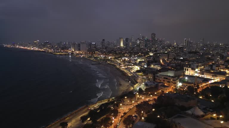 Aerial footage of the waterfront of Tel Aviv - Yafo  at afternoon and dusk in summer