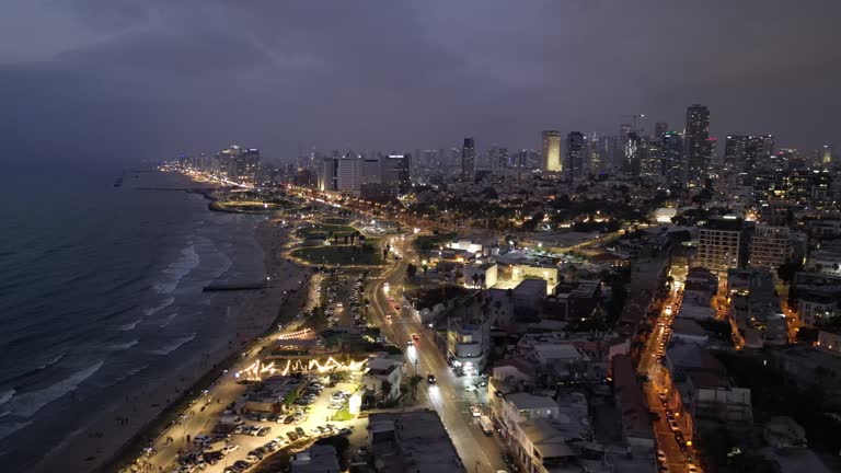 Aerial footage of the waterfront of Tel Aviv - Yafo  at afternoon and dusk in summer