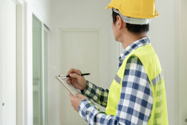 istock inspector or engineer is inspecting construction and quality assurance new house using a checklist. Engineers or architects or contactor work to build the house before handing it over to the homeowner 1635982404