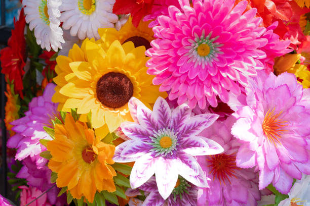 istock Bright colors of plastic flowers. 1636000442