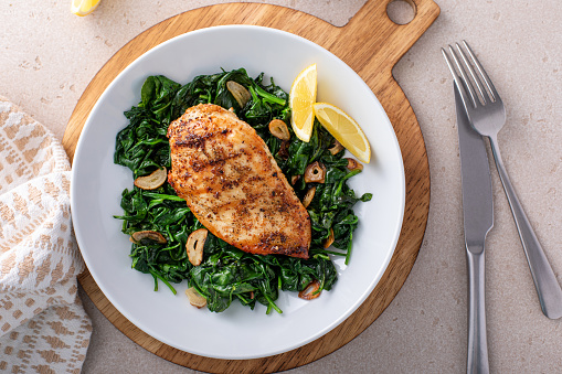 Grilled chicken with sauteed spinach and lemon, healthy dinner idea