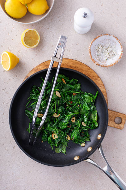 istock Sauteed spinach with garlic in a skillet 1636016488