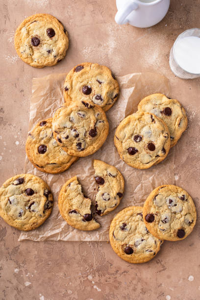 istock Chocolate chip cookies with flaky salt on parchment paper 1636017118