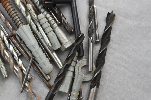 istock Close-up of drill bits with screws ready for work, representing efficiency in construction. Set of close-up drills, perfect for representing precise work in the field of construction. 1636018902