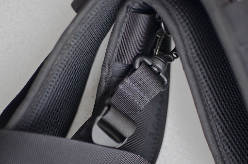 Black suspender or belt close-up, elegant and high-quality accessory to complete your style. Concept for backpacks or military accessories.