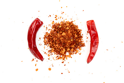 red ground paprika powdered or dry chili pepper isolated on white background