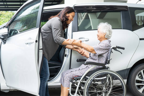 Asian senior woman patient sitting on walker prepare get to her car, healthy strong medical concept. Asian senior woman patient sitting on walker prepare get to her car, healthy strong medical concept. senior adult car nurse physical impairment stock pictures, royalty-free photos & images