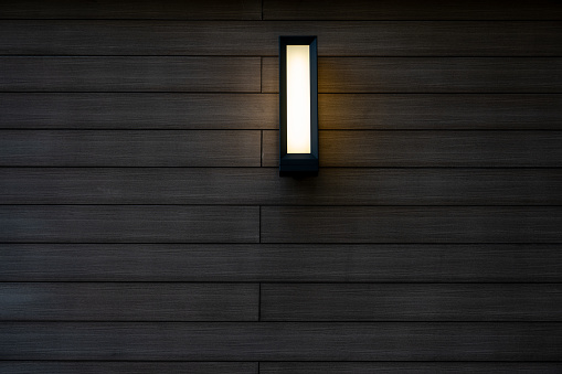 Close up glowing vintage light bulb. Isolated on black background