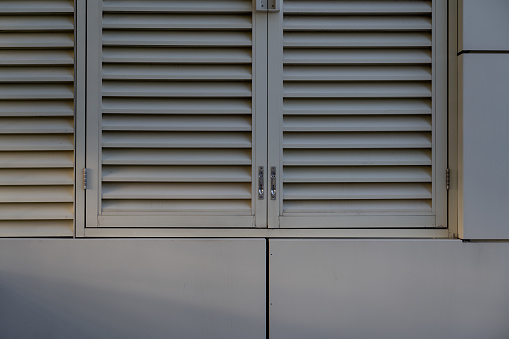 Light shining on white blinds