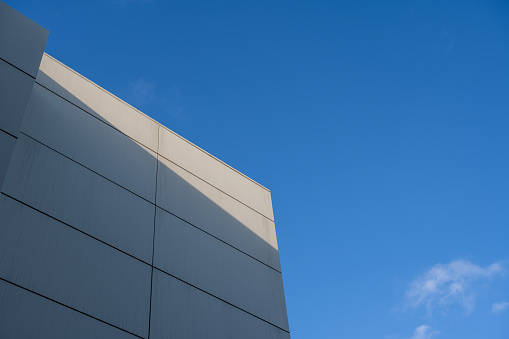 Low angle vision of light shining on white buildings