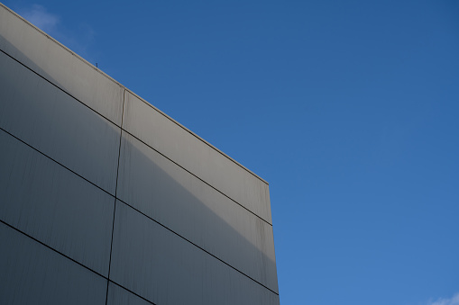 Low angle vision of white buildings under clear skies