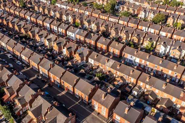 Photo of Aerial view above rows of back to back terraced houses on a large council estate