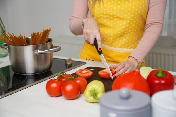 Woman cooking stock photo