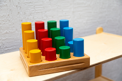Wooden montessori board with colorful circle shapes