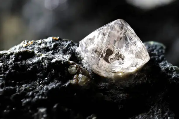 Photo of natural diamond nestled in kimberlite