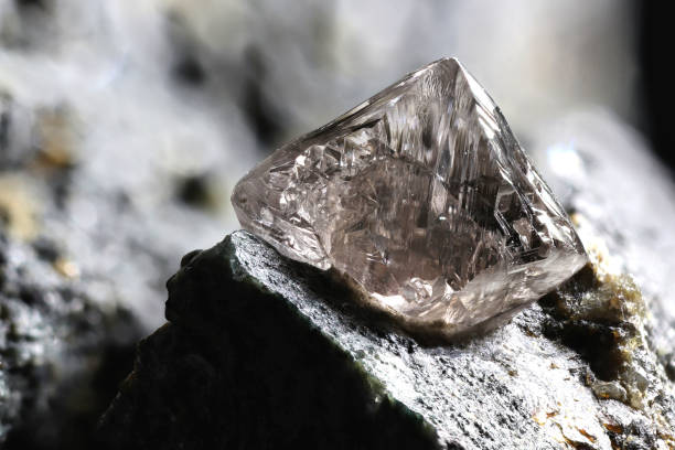 istock natural diamond nestled in kimberlite 1636186684